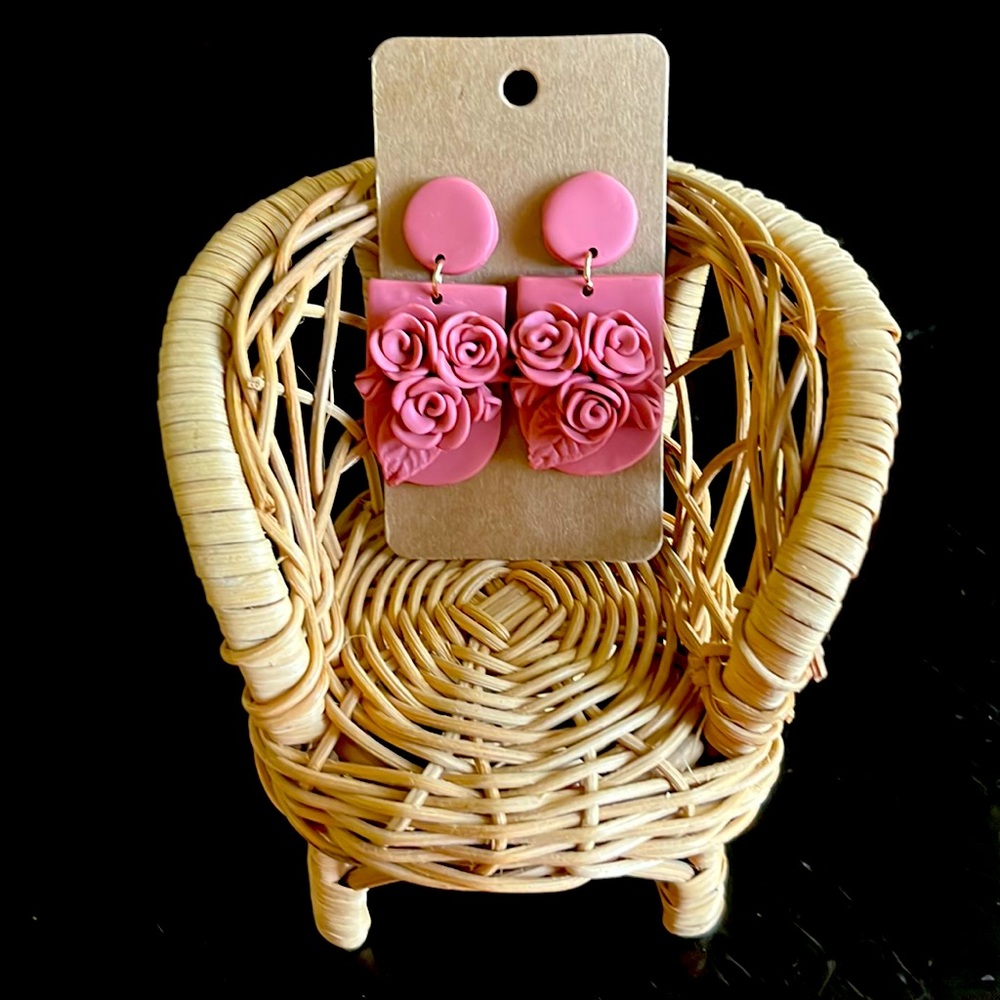 Polymer clay earrings. Mauve-like color with florals and leaf accents.